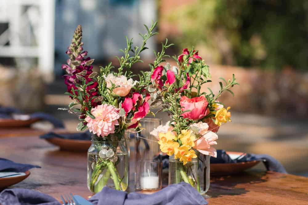 Reception table florals in mason jars